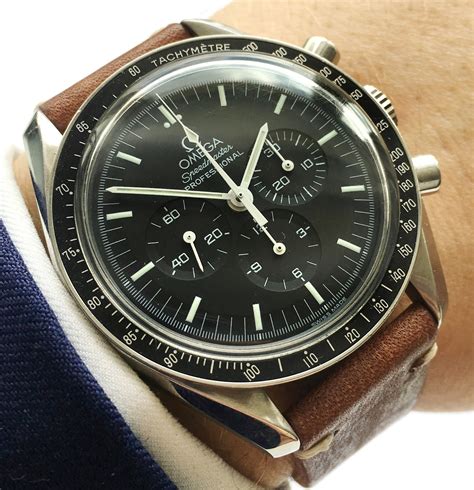 omega speedmaster moonwatch with a metal band.|Omega Speedmaster moonwatch original size.